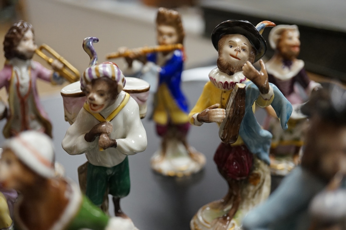 A group of twenty German porcelain monkey band figures, largest 15.5cm high